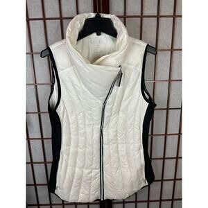 This is a Calvin Klein Performance asymmetrical zip puffer vest white and black